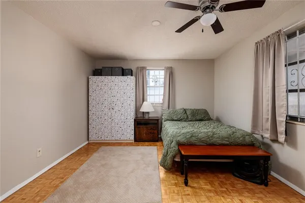 a bedroom with a bed and window
