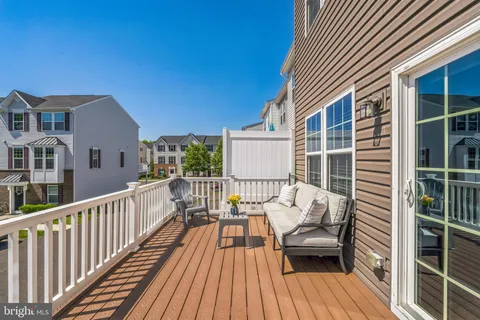 a view of balcony with furniture