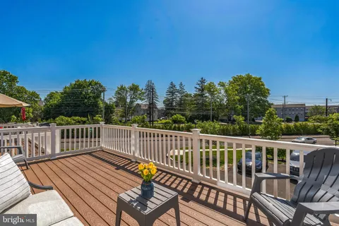 a view of a two chairs on the roof deck