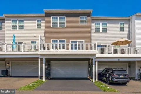 a couple of cars parked in front of a building