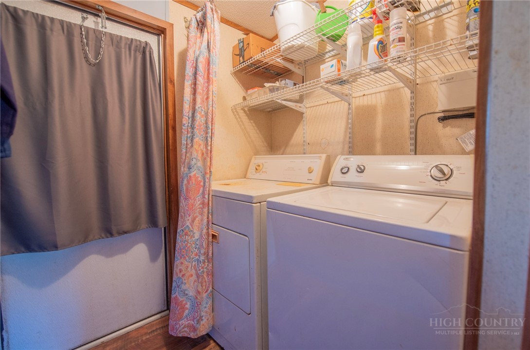 1848 West Mill Creek Road Warrensville, NC 28693 - Photo 25 of 50 a utility room with dryer and washer