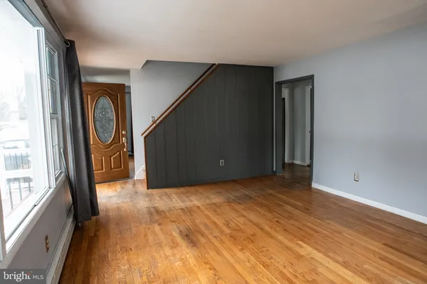a view of entryway with wooden floor