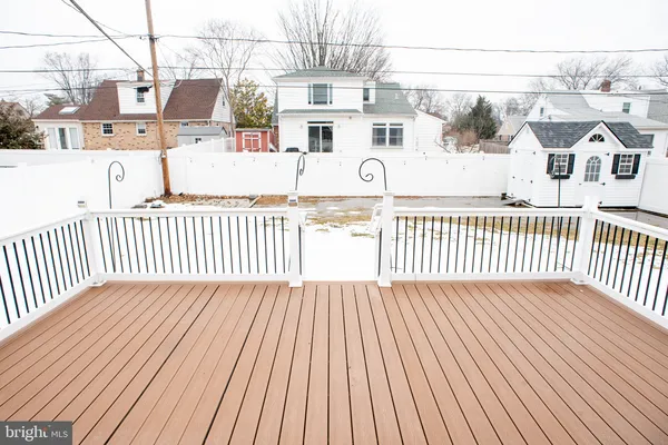 a view of a balcony with wooden floor