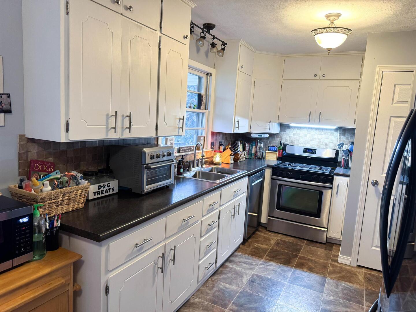 300 Williford Road Jonesboro, IL 62952 - Photo 22 of 34 Kitchen featuring dark countertops, stainless stee