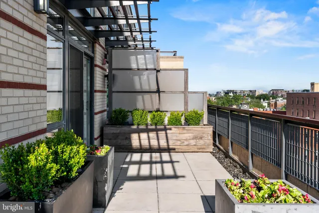 a view of a balcony with chairs