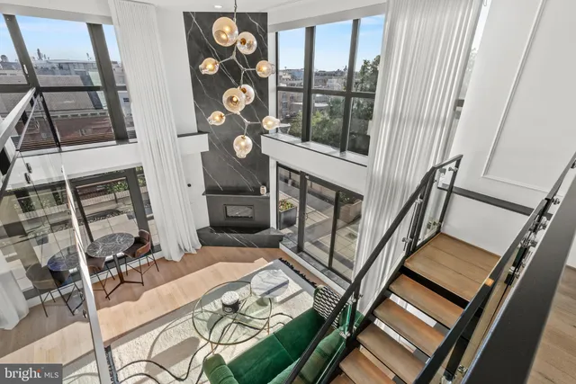a view of an chairs and table in the balcony