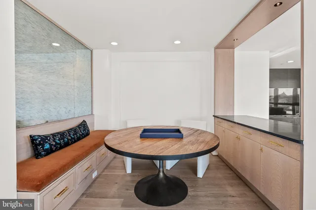 a kitchen with stainless steel appliances granite countertop a sink and a refrigerator