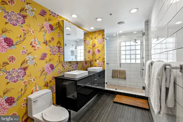 a bathroom with a sink toilet and shower