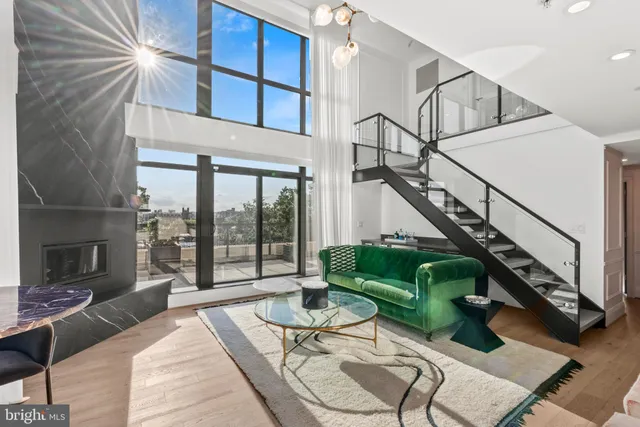 a balcony with table and chairs