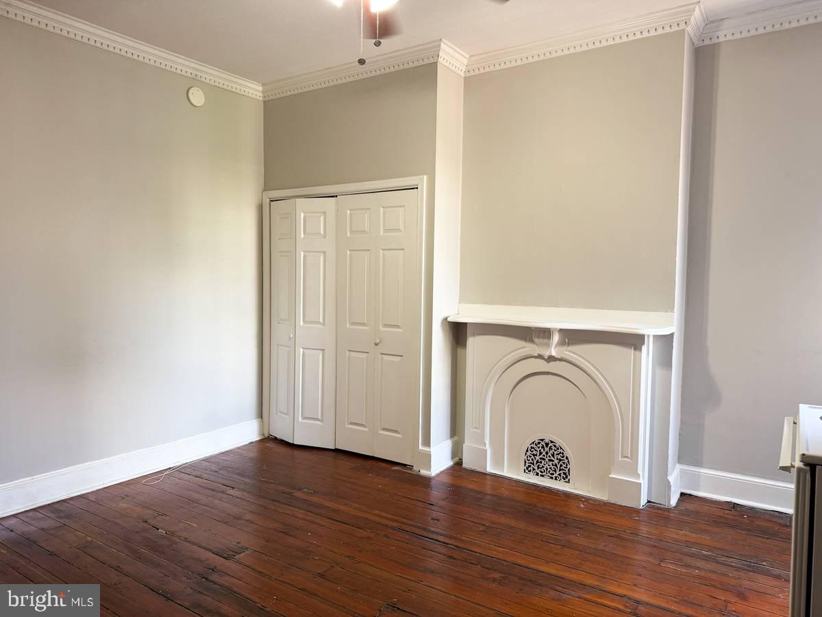 2209 Walnut Street, Unit 3M Philadelphia, PA 19103 - Photo 5 of 7 a view of a storage & utility room with wooden floor