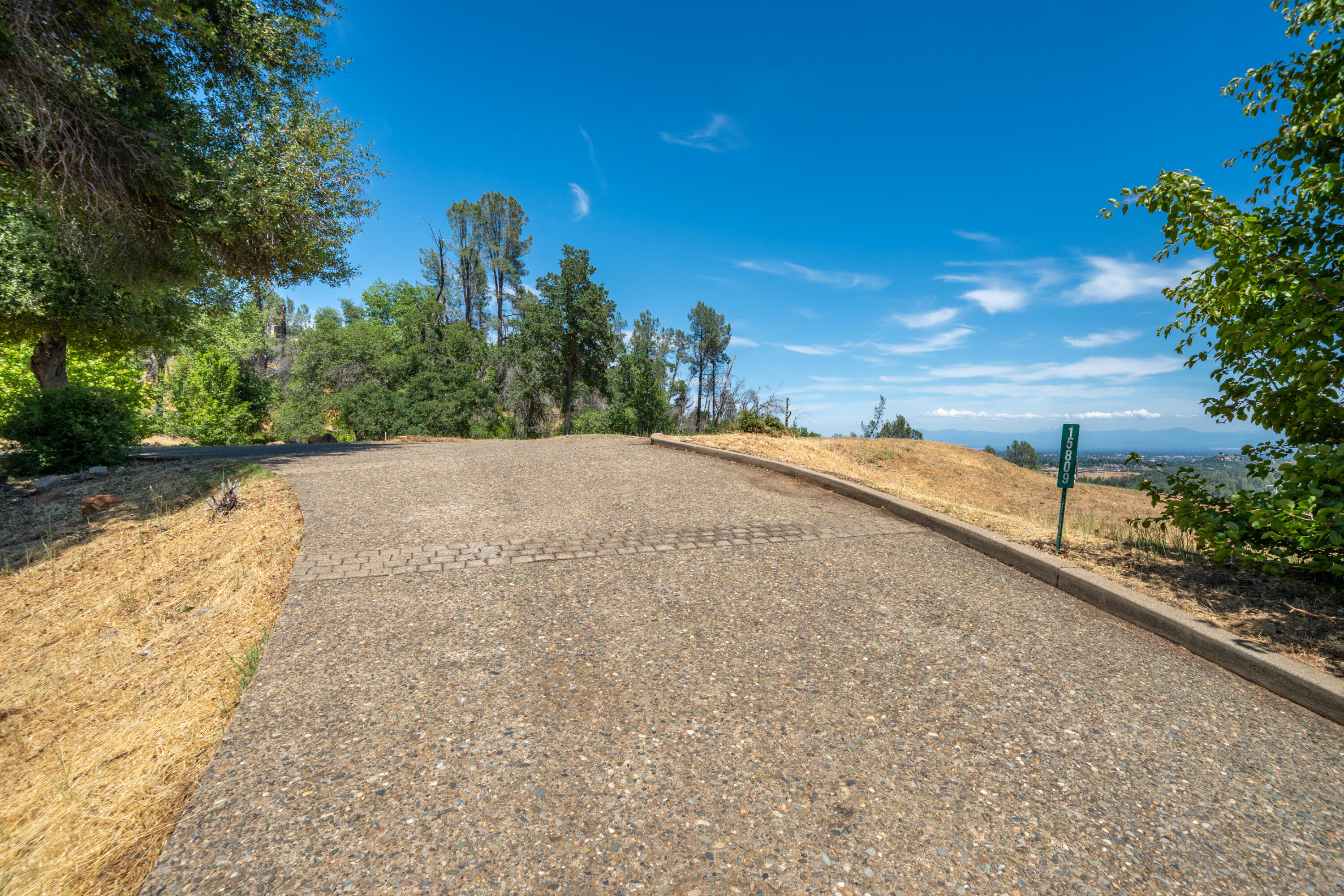 15809 Old Stage Coach Road Redding, CA 96001 - Photo 9 of 44 a view of a road with a yard