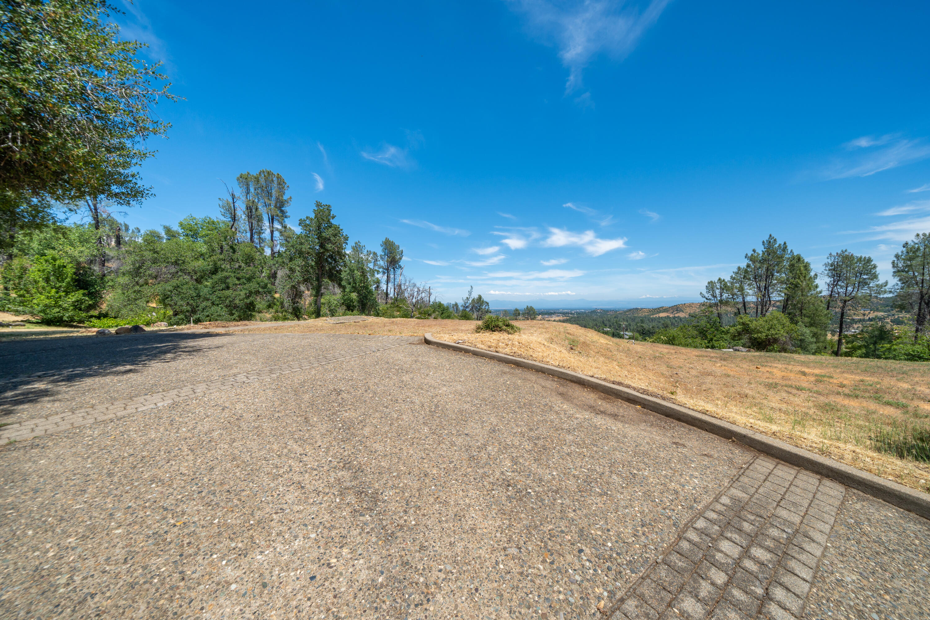 15809 Old Stage Coach Road Redding, CA 96001 - Photo 10 of 44 a view of a road with a yard