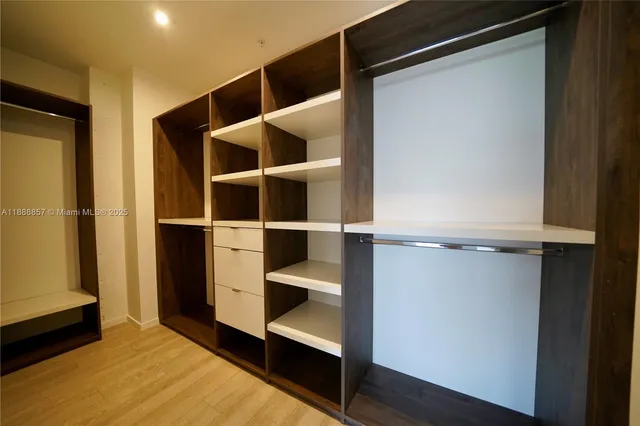 a view of an empty walk in closet