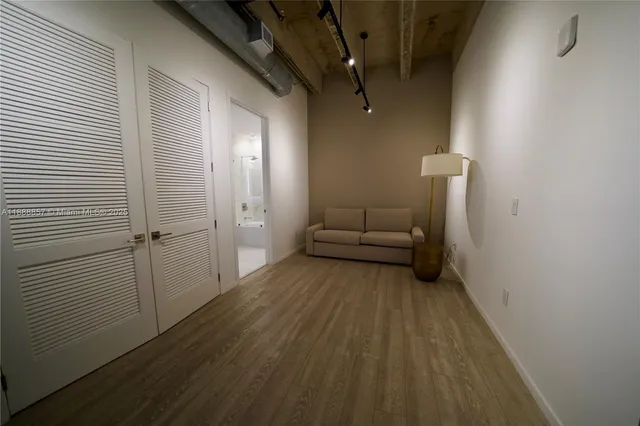 a view of a livingroom with wooden floor