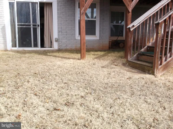 a view of a house with backyard of the house