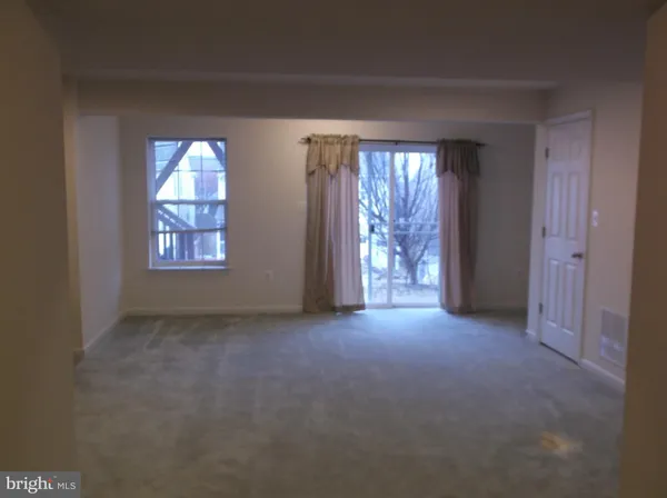 an empty room that has a window