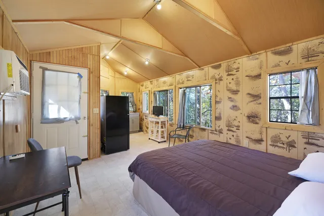 a bathroom with a sink mirror and a bathtub