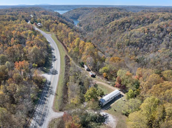 an aerial view of house with yard