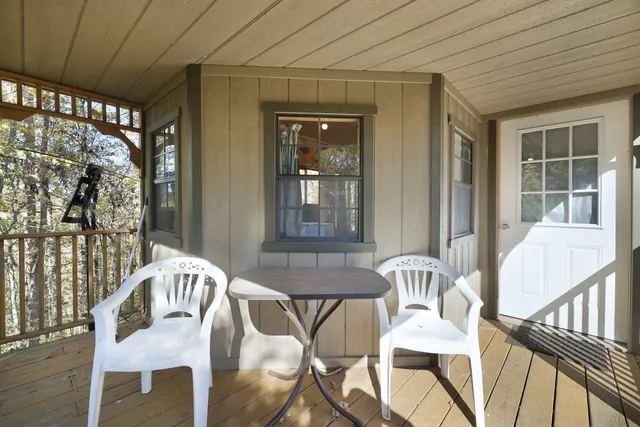 a spacious bedroom with a bed and a chair