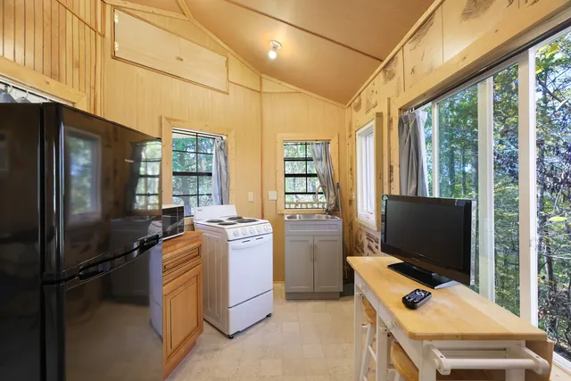 a kitchen that has a stove and a refrigerator