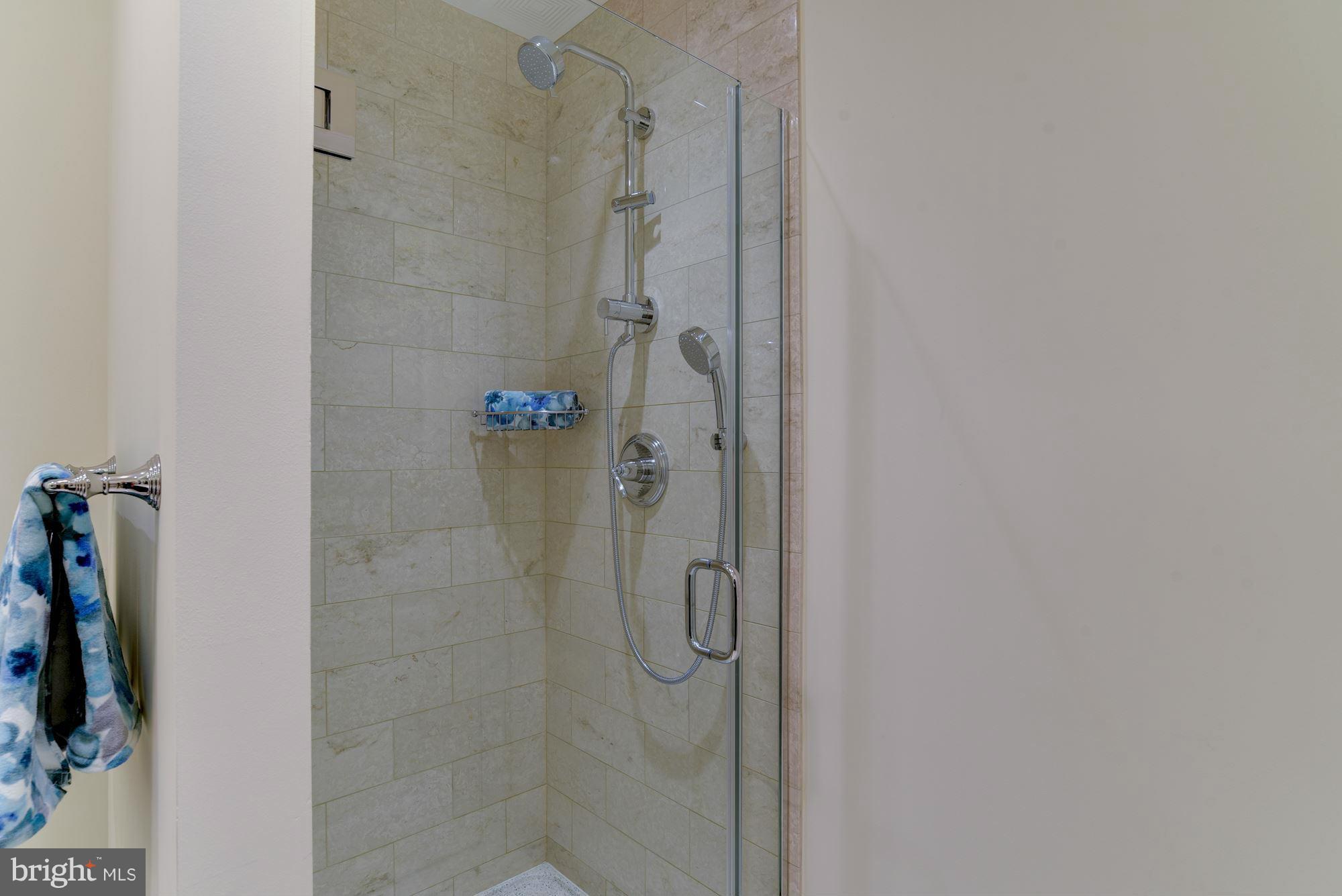 2425 L Street Northwest, Unit 340 Washington, DC 20037 - Photo 22 of 30 a bathroom with a glass shower door