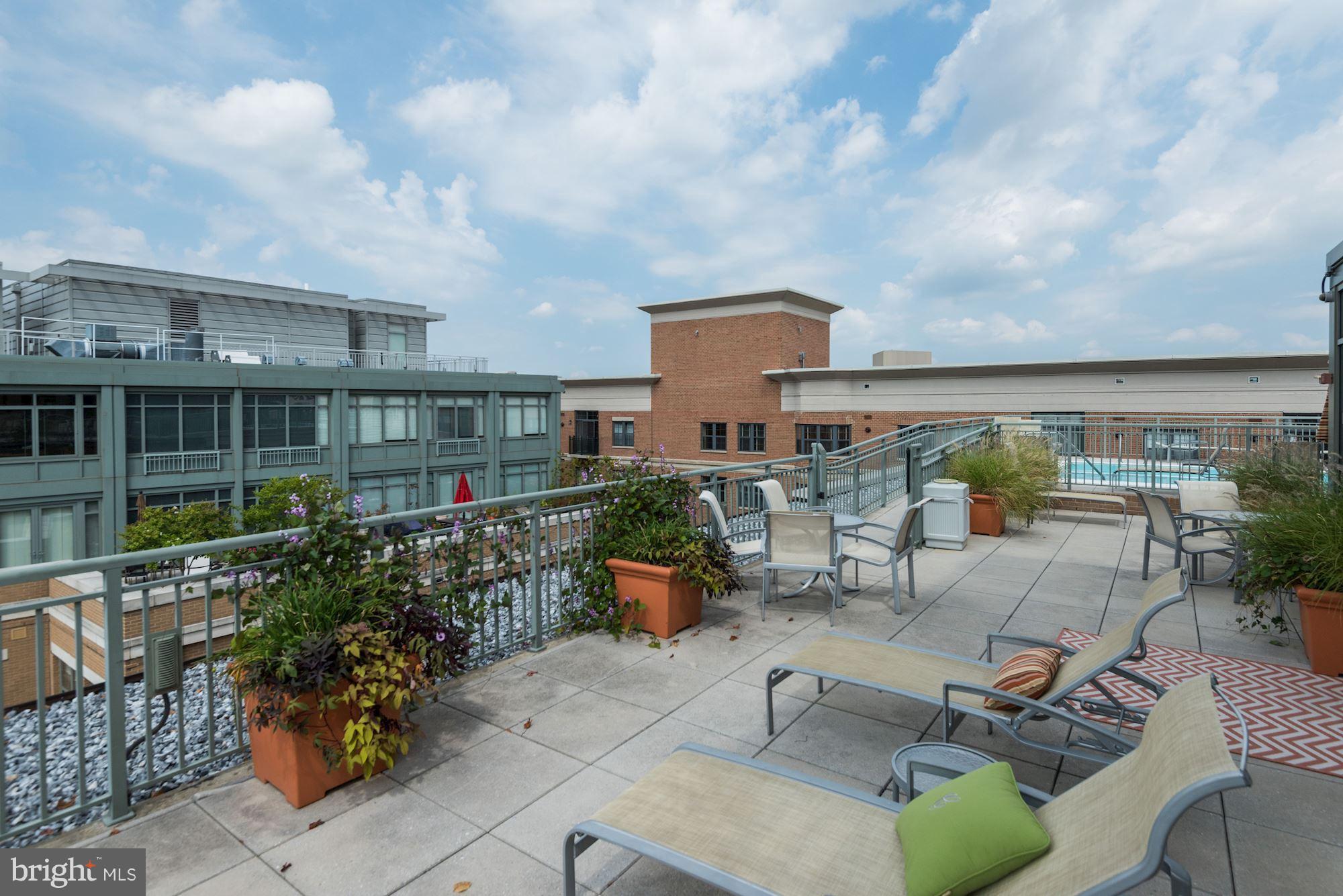 2425 L Street Northwest, Unit 340 Washington, DC 20037 - Photo 25 of 30 a view of a chairs and table in patio