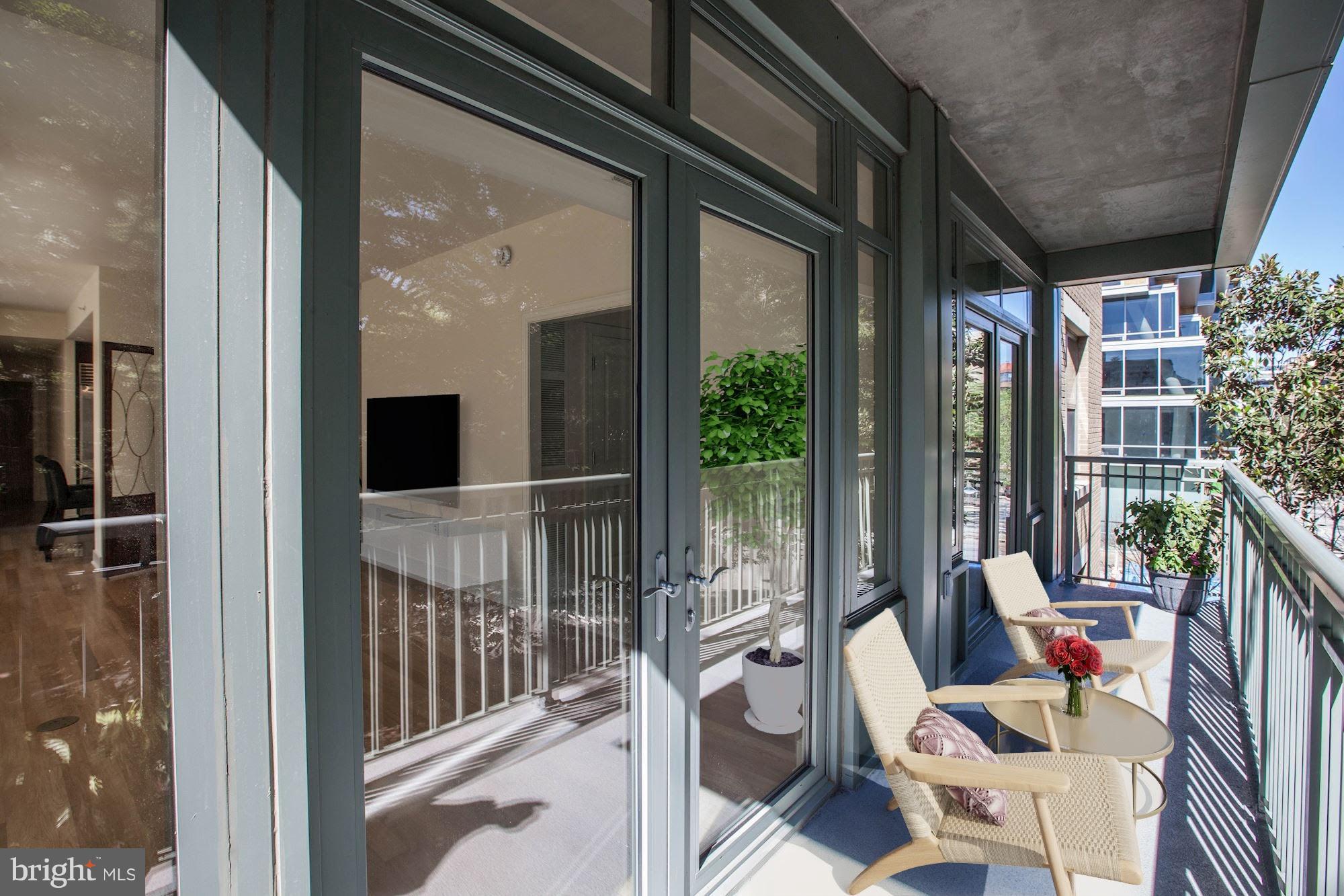 2425 L Street Northwest, Unit 340 Washington, DC 20037 - Photo 7 of 30 a view of balcony with furniture