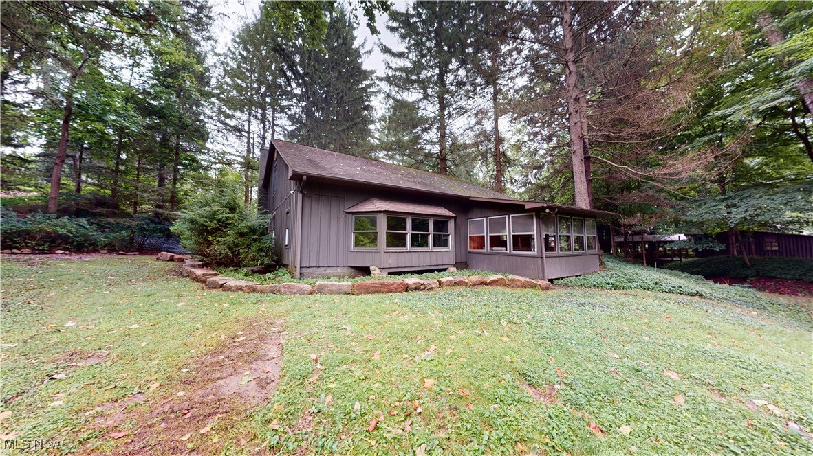 13696 Sperry Road Novelty, OH 44072 - Photo 23 of 40 Rear view of house featuring a yard