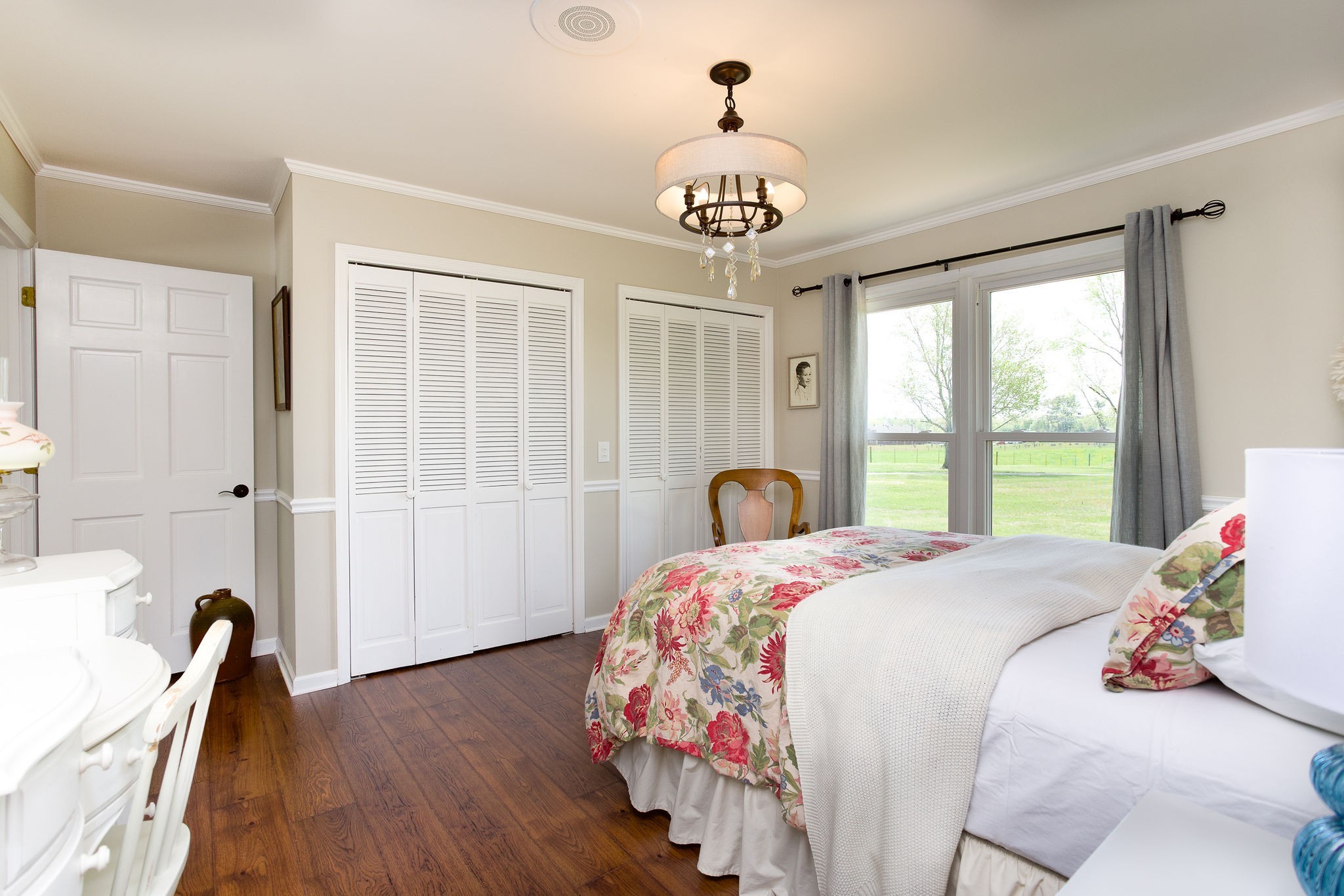 1747 Allen Ferry Road Smithville, TN 37166 - Photo 24 of 45 a bedroom with a bed and a chandelier