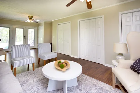 a swimming pool with trees in the background