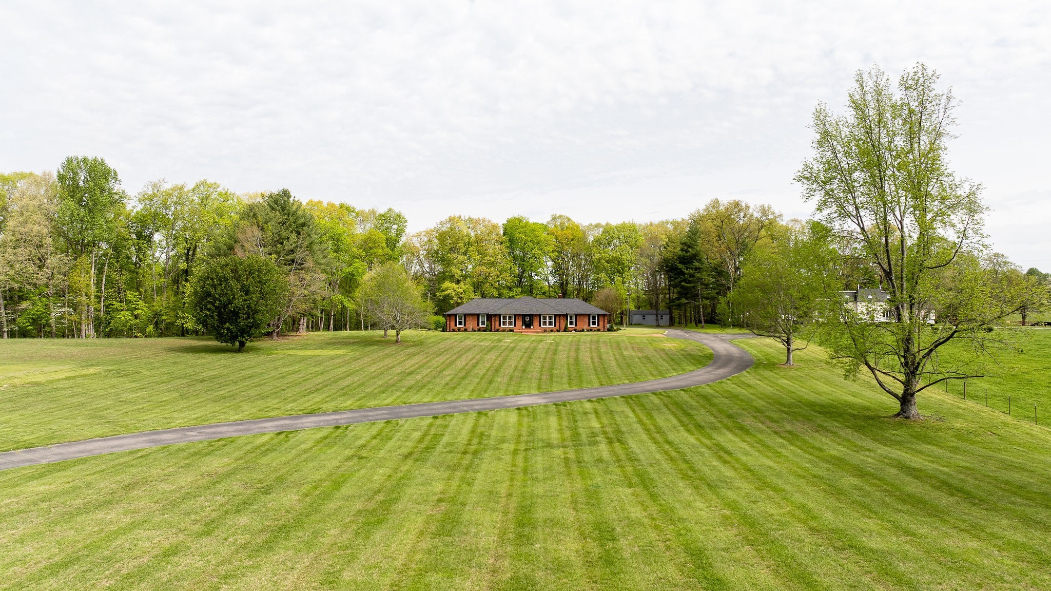 1747 Allen Ferry Road Smithville, TN 37166 - Photo 29 of 45 a swimming pool with trees in the background