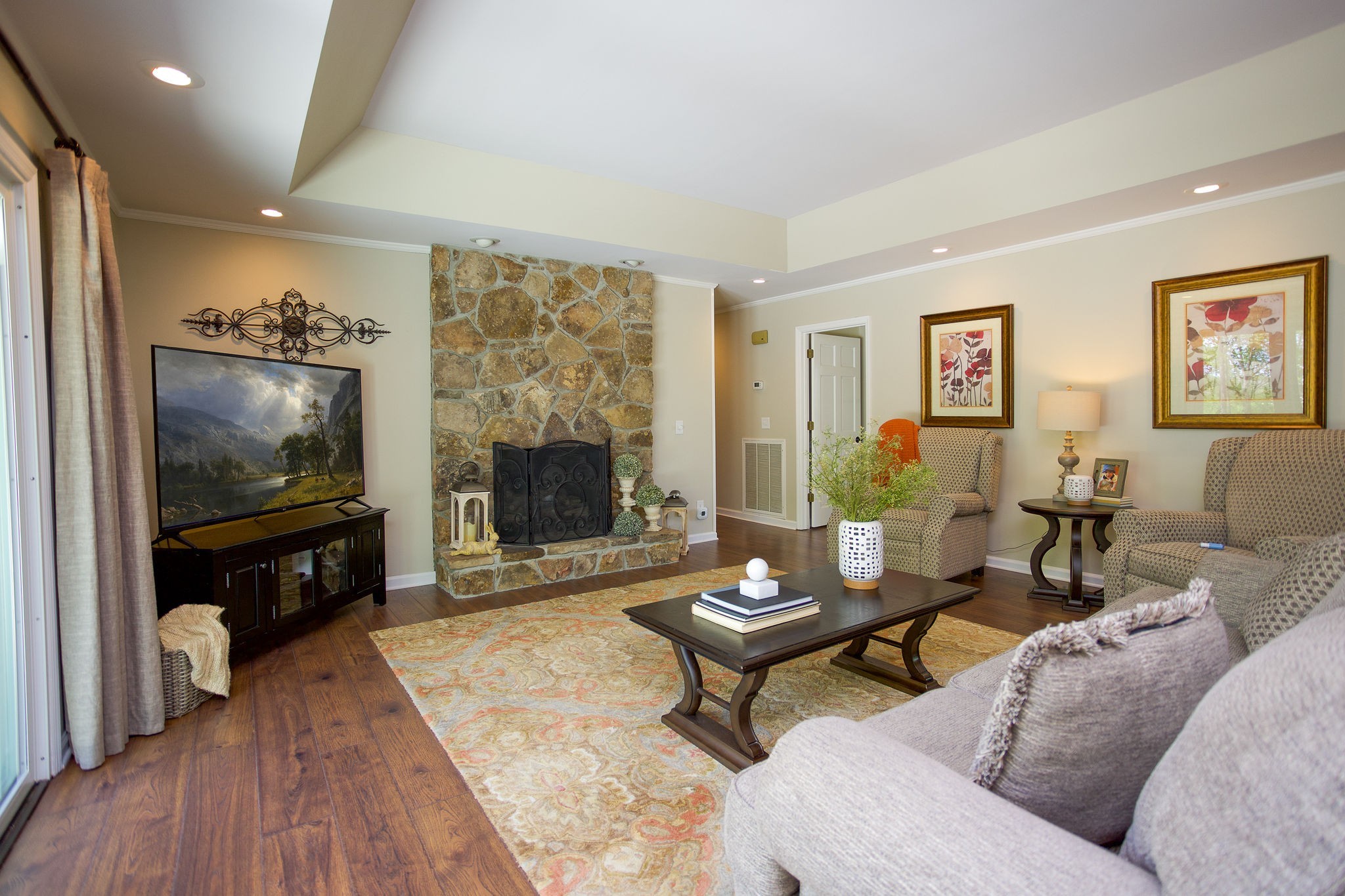 1747 Allen Ferry Road Smithville, TN 37166 - Photo 10 of 45 a living room with furniture a flat screen tv and a fireplace