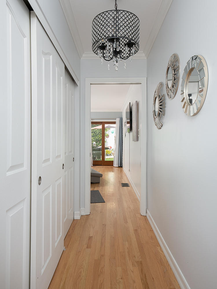 2750 North Kenneth Road Burbank, CA 91504 - Photo 14 of 32 a view of a hallway with wooden floor
