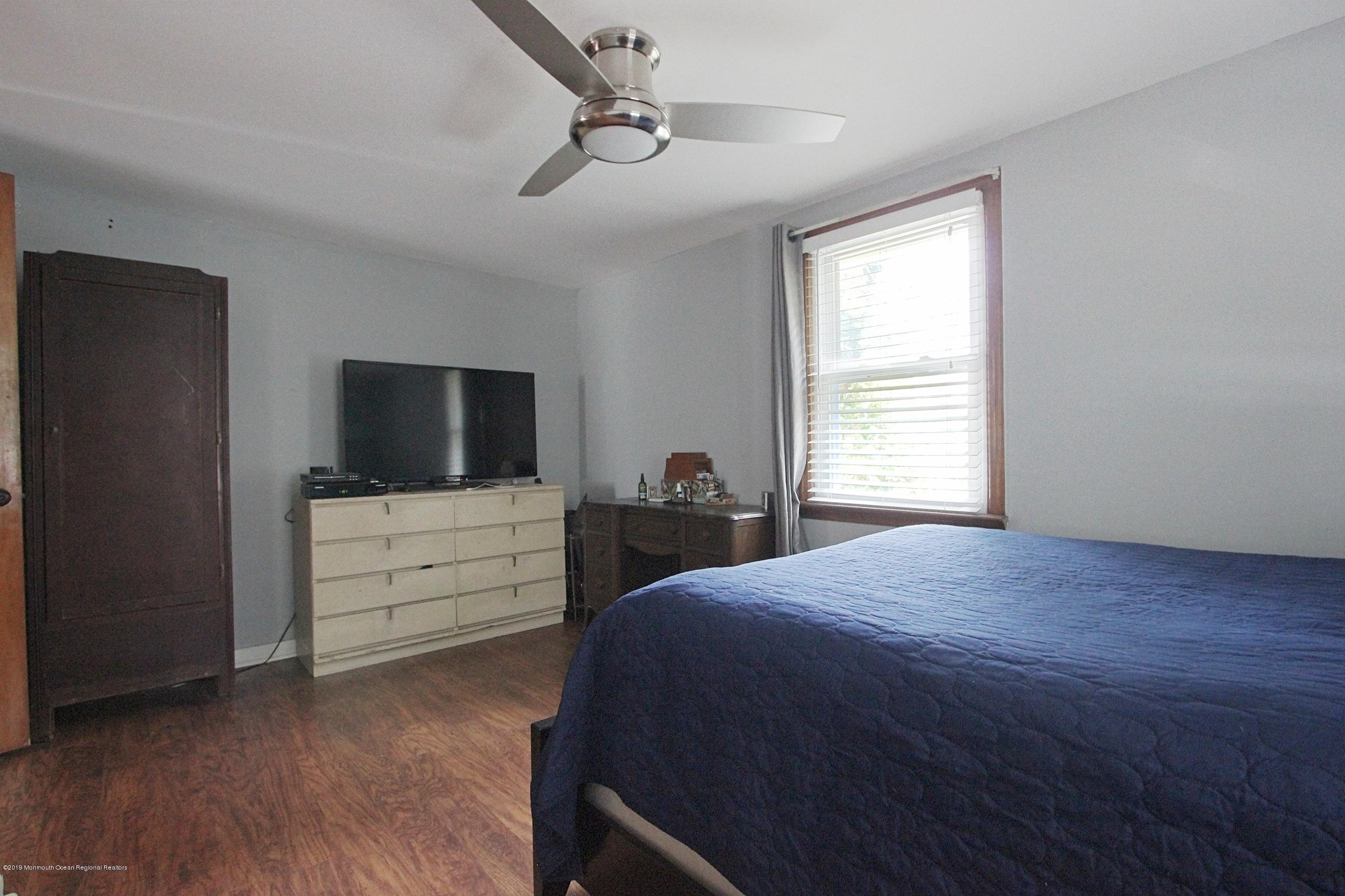 500 Hyson Road Jackson, NJ 08527 - Photo 11 of 30 a bedroom with a bed and a flat screen tv