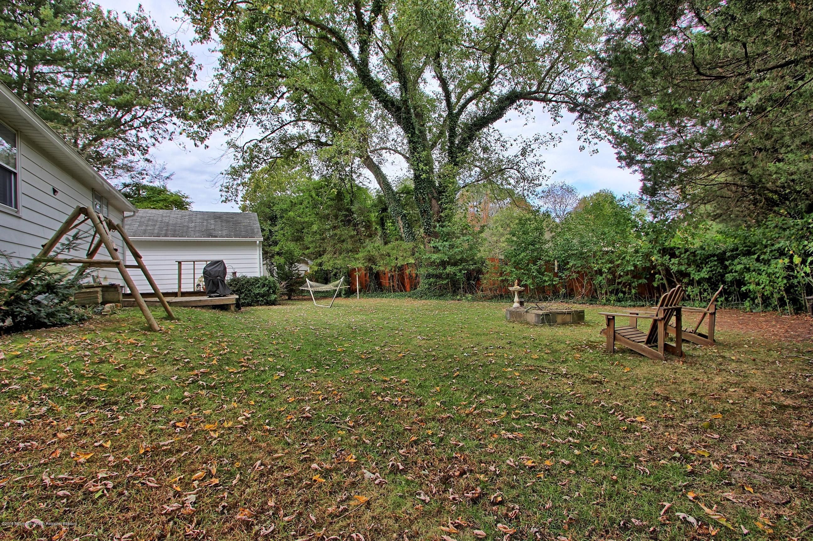 500 Hyson Road Jackson, NJ 08527 - Photo 25 of 30 a view of a house with a back yard