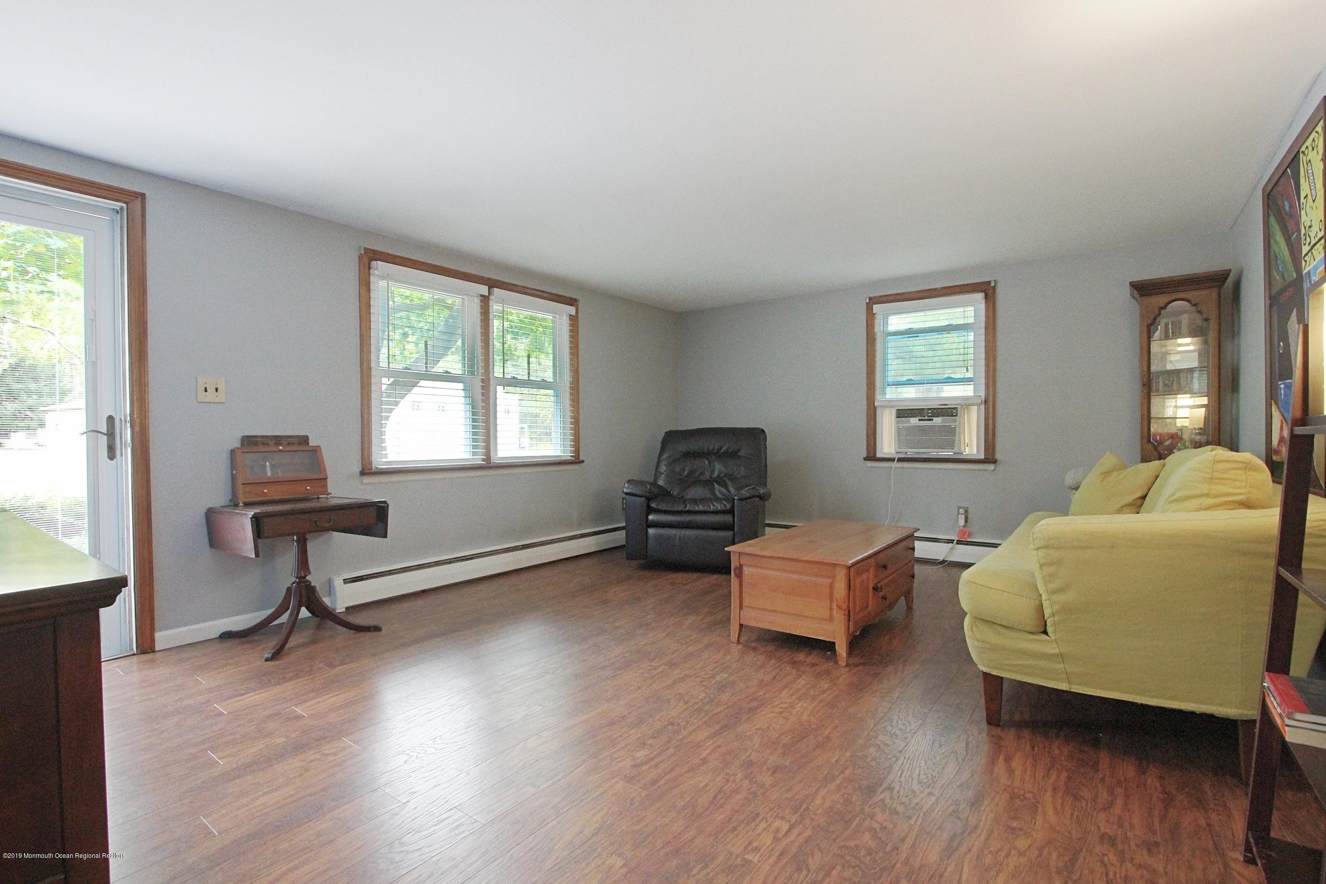 500 Hyson Road Jackson, NJ 08527 - Photo 3 of 30 a living room with furniture window and wooden floor