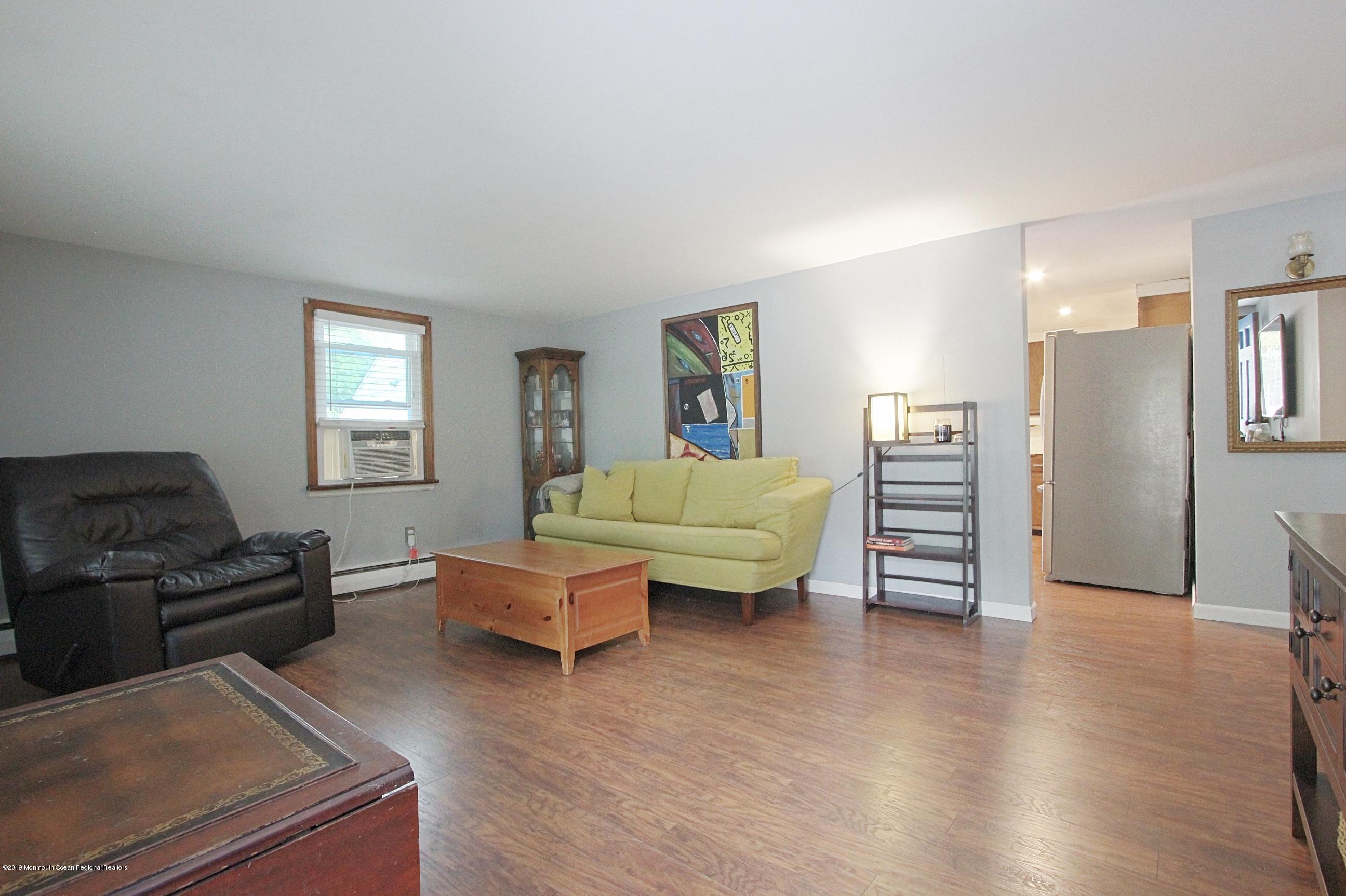 500 Hyson Road Jackson, NJ 08527 - Photo 4 of 30 a living room with furniture and wooden floor