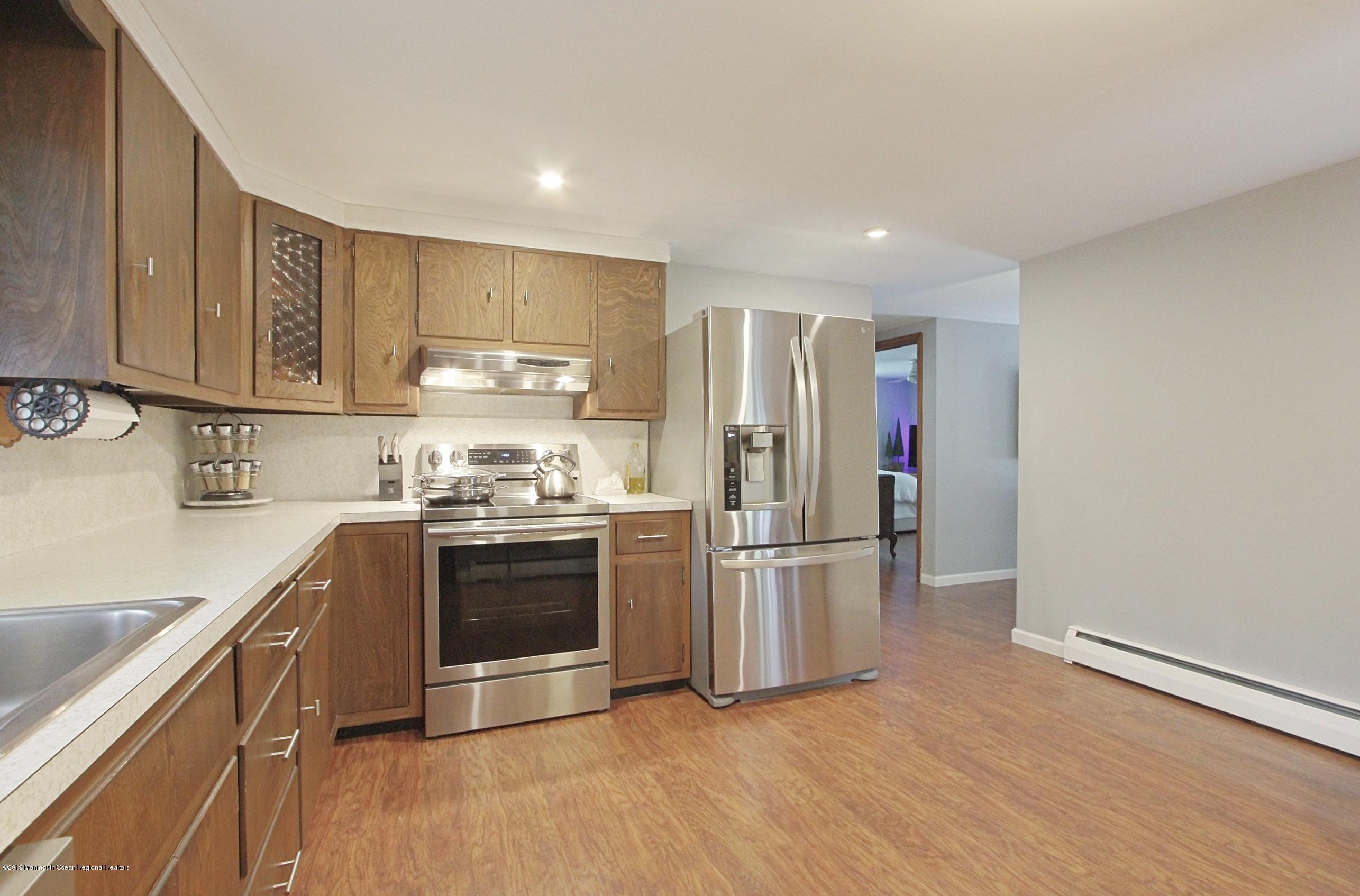 500 Hyson Road Jackson, NJ 08527 - Photo 7 of 30 a kitchen with stainless steel appliances granite countertop a refrigerator and a stove top oven