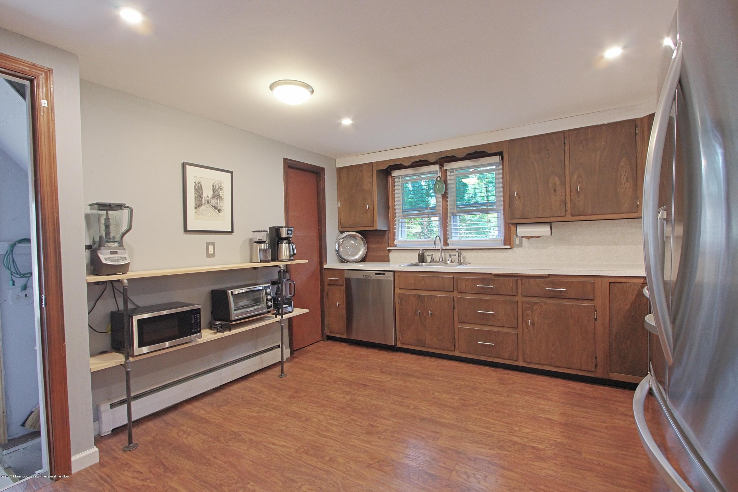 500 Hyson Road Jackson, NJ 08527 - Photo 8 of 30 a kitchen with sink a microwave and cabinets