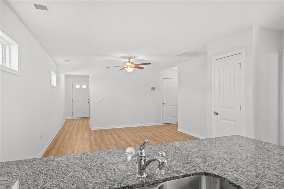 118 Adger Road Pendleton, SC 29670 - Photo 9 of 31 This bright, open concept living area features resilient flooring and ample natural light.