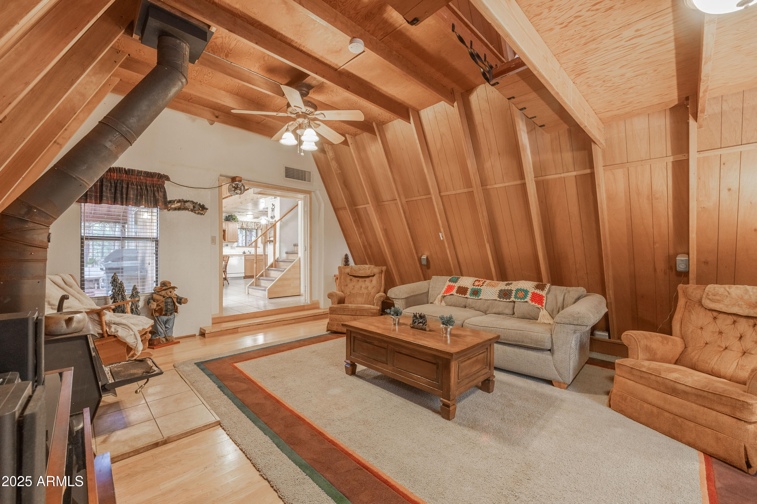 1643 Rifle Way Forest Lakes, AZ 85931 - Photo 22 of 40 a living room with furniture and large windows