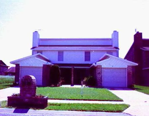 a house view with a seating space and garden
