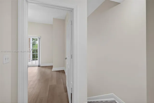 a bathroom with a sink double vanity granite tub and a mirror