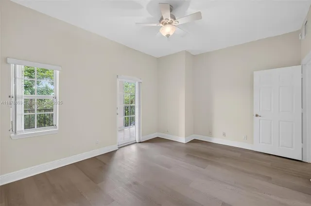 a bathroom with a granite countertop toilet a sink and shower