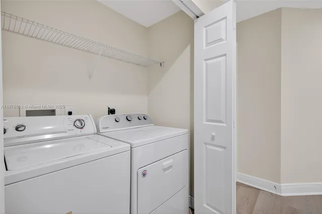 a bathroom with a sink toilet tub and shower