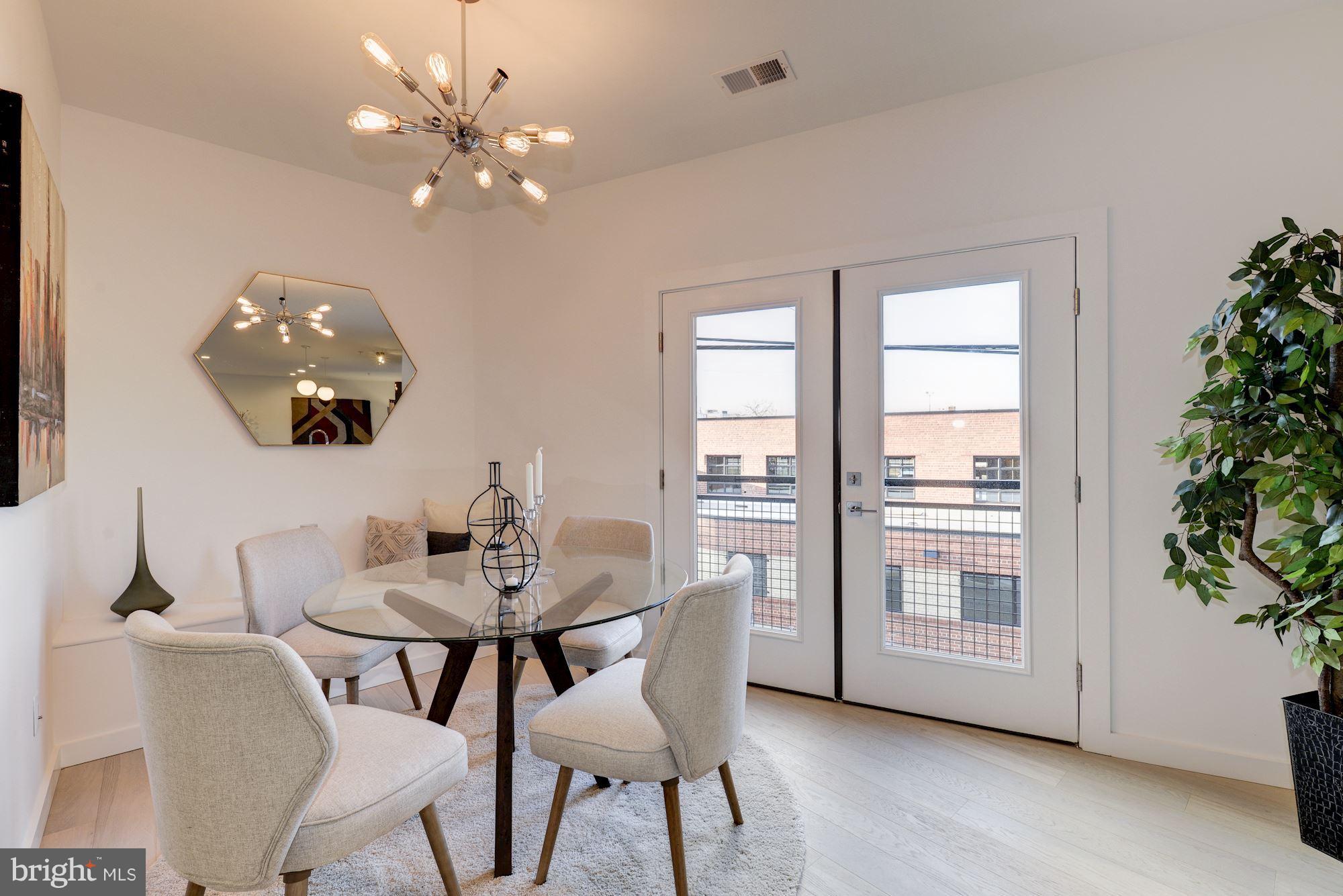 1869 Corcoran Street Northeast, Unit B Washington, DC 20002 - Photo 18 of 30 a dining room with furniture and chandelier