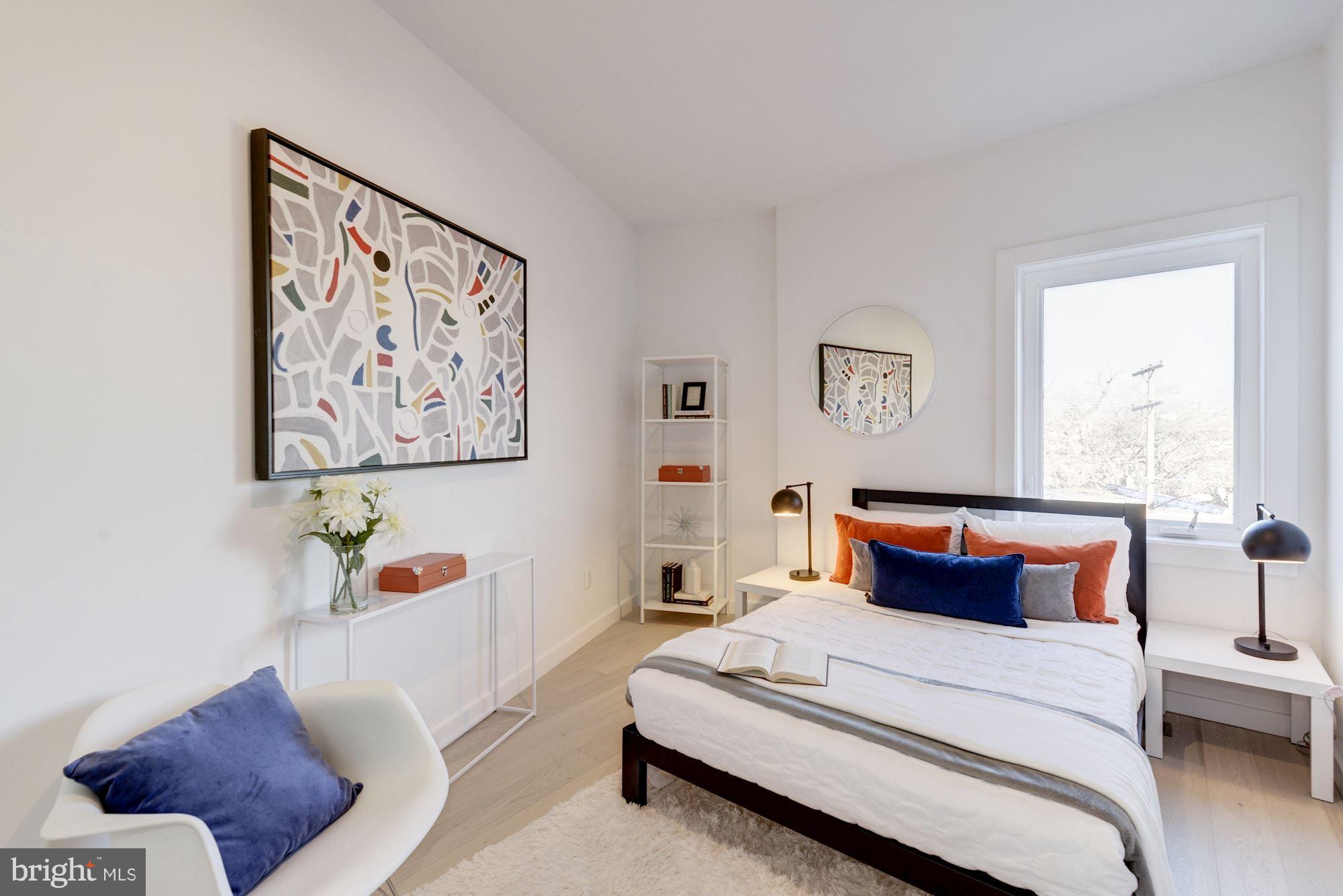 1869 Corcoran Street Northeast, Unit B Washington, DC 20002 - Photo 24 of 30 a bedroom with a bed and a couch