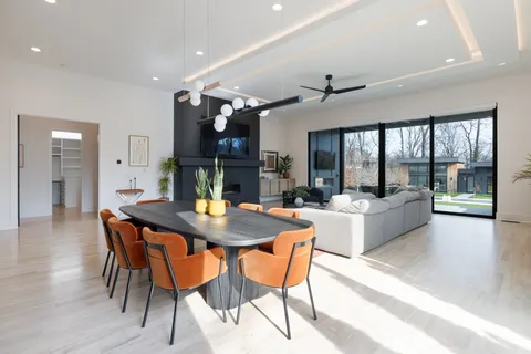 a bathroom with a double vanity sink mirror and shower