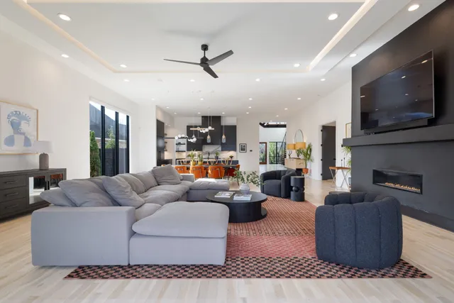 a view of a hallway with wooden floor and windows