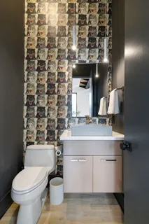 a bedroom with a bed wooden floor and window